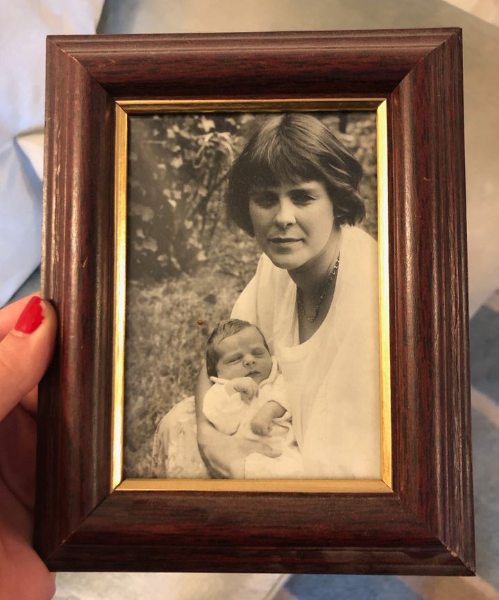 A framed photo of Julien and his mother in the early 1990s.