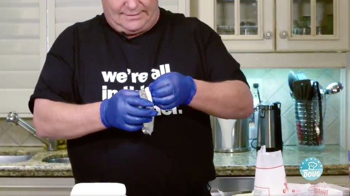 Why is Doug Ford wearing gloves to make cheesecake? 