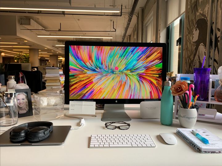 A snapshot of our wellness editor's desk in pre-coronavirus times. Incorporating parts of your office desk might help make your home setup feel a little more work-inspired.