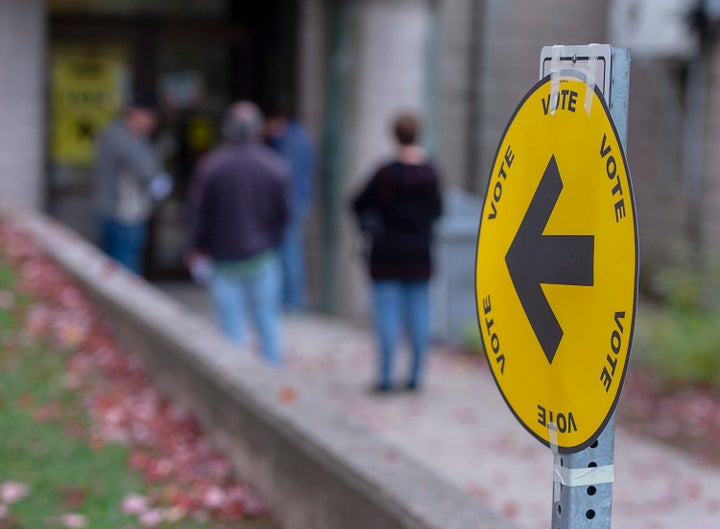 File photo of voters lining up to cast their ballot in Canada's federal election at the Fairbanks Interpretation Centre in Dartmouth, N.S., on October 21, 2019.