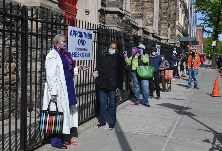 Residents wait in line Thursday to get tested for COVID-19 antibodies at Abyssinian Baptist Church in the Harlem neighborhood of New York City.