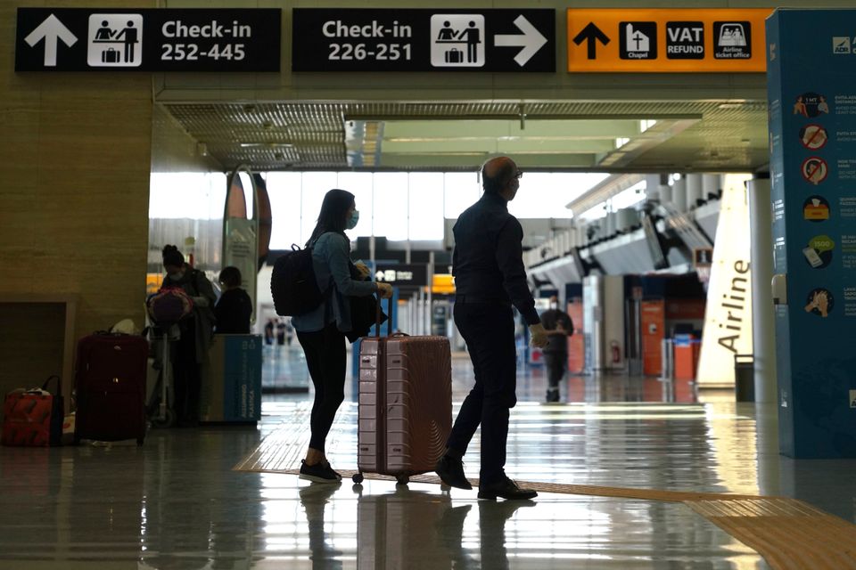 Passengers walk through Rome's Leonardo da Vinci international airport in Fiumicino.