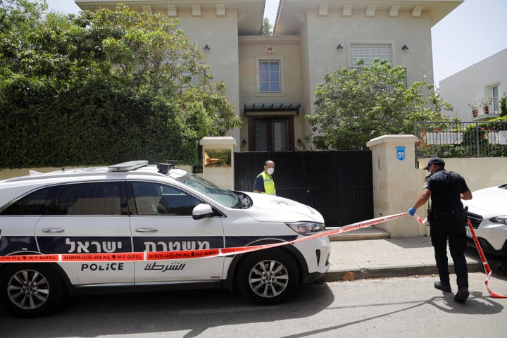 An Israeli policeman cordons off an area near the house of China's ambassador to Israel, Du Wei, in Herzliya, near Tel Aviv, Israel on May 17, 2020.