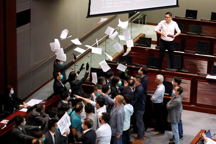 Pan-democratic legislator Lam Cheuk-ting tears the paper of Rule of Procedure during Legislative Council’s House Committee meeting, in Hong Kong, China May 18, 2020. REUTERS/Tyrone Siu