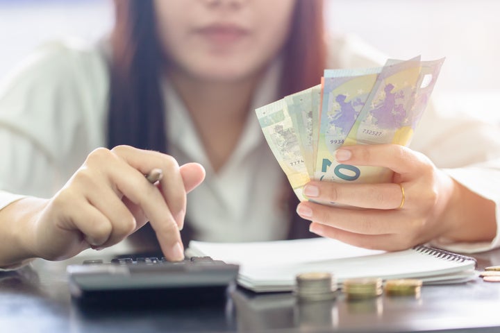 Woman counting money Euro banknotes, Business or stock market concept image.