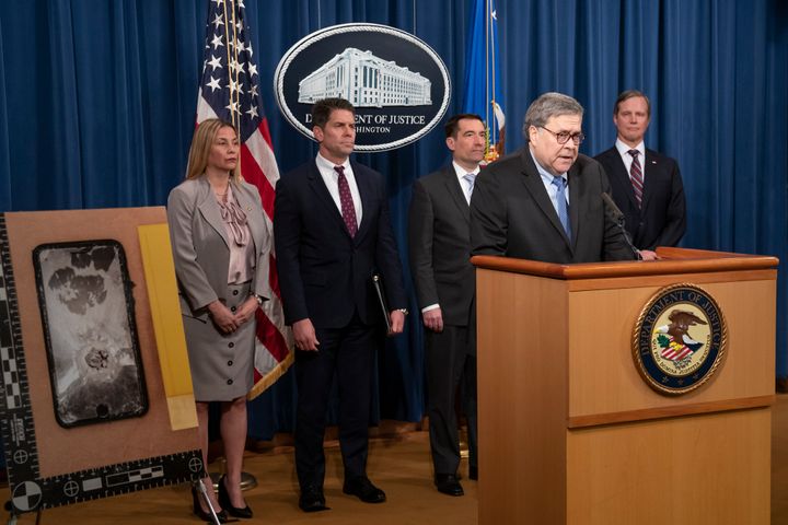 Attorney General William Barr and FBI Deputy Director David Bowdich, second from left, address reporters at the Justice Department in Washington, Monday, Jan. 13, 2020, to announce results of an investigation of the shootings at the Pensacola Naval Air Station in Florida. (AP Photo/J. Scott Applewhite)