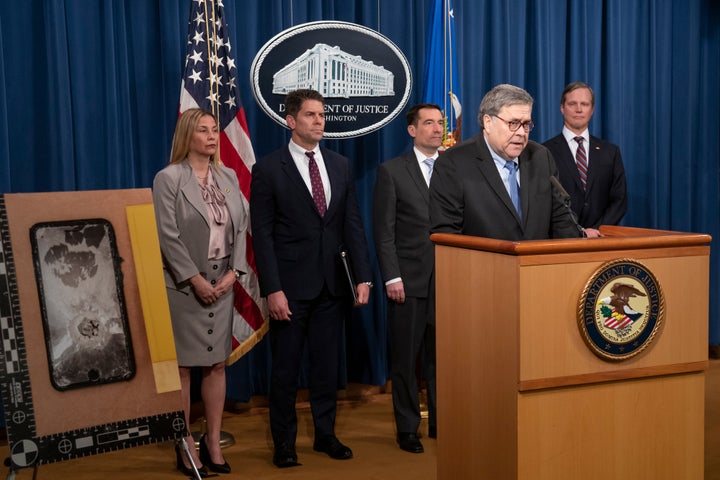 Attorney General William Barr and FBI Deputy Director David Bowdich, second from left, address reporters at the Justice Depar
