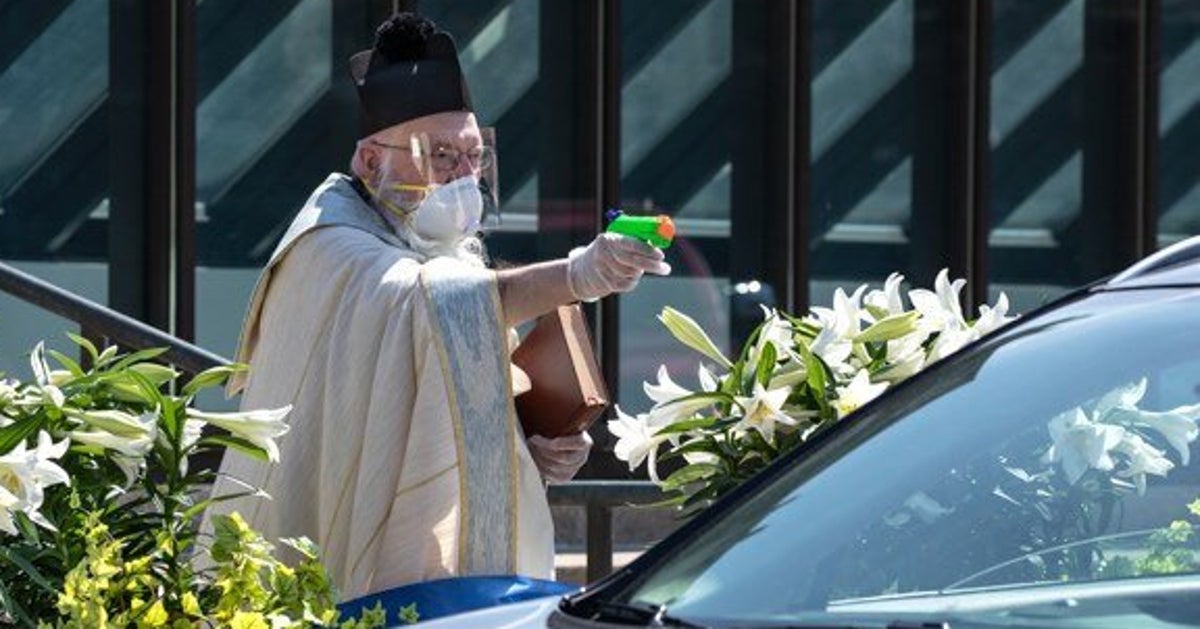 Priest Goes Viral After Using Squirt Gun Full Of Holy Water To Bless ...