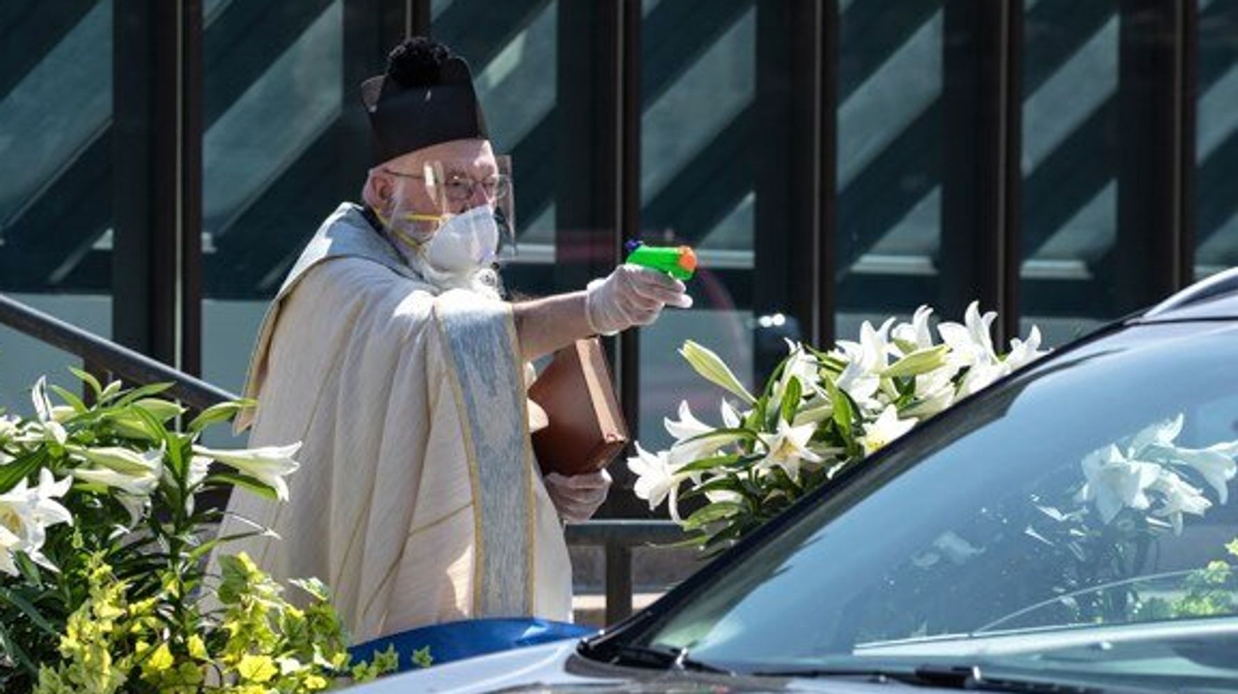 Priest Goes Viral After Using Squirt Gun Full Of Holy Water To Bless  Churchgoers | HuffPost News