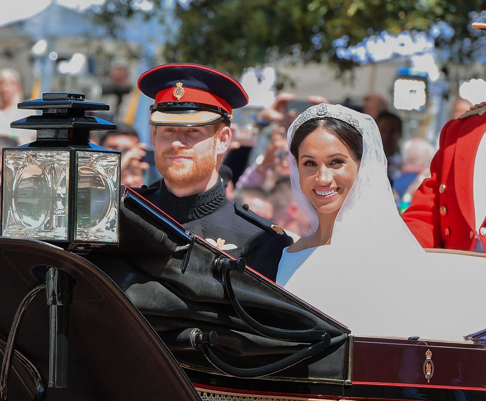 The Duke and Duchess of Sussex leave Windsor Castle in the Ascot Landau carriage during a procession after their nuptials.&nbsp;