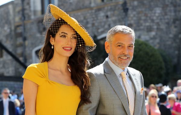 Amal Clooney and George Clooney arrive.