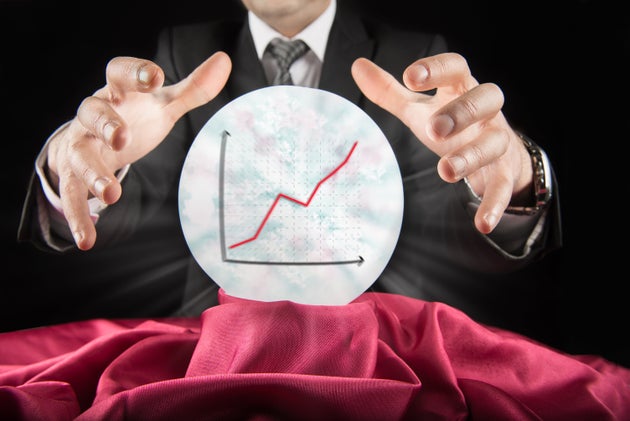 Fortune teller businessman, sees rising graph in a crystal ball          