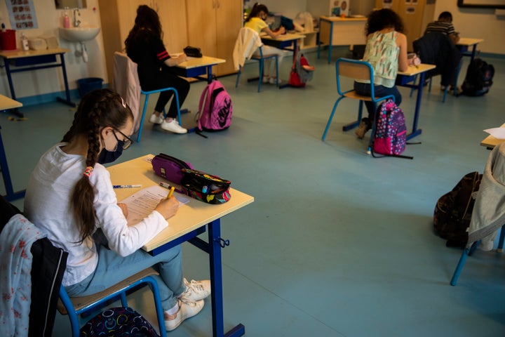 Students wearing face masks and social distancing, at a primary school in Brussels on Monday 