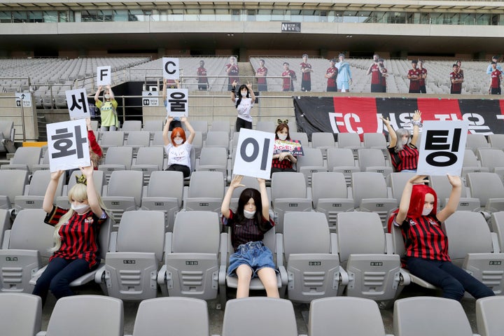 Cheering mannequins are installed at the empty spectators' seats before the start of soccer match between FC Seoul and Gwangju FC at the Seoul World Cup Stadium in Seoul, South Korea. 