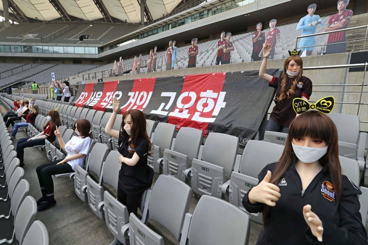 Cheering mannequins are installed at the empty spectators' seats before the start of soccer match between FC Seoul and Gwangj