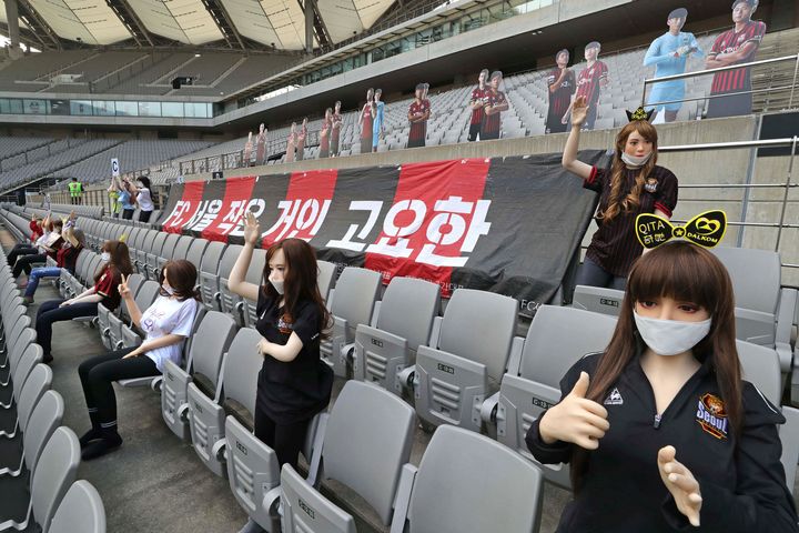 Cheering mannequins are installed at the empty spectators' seats before the start of soccer match between FC Seoul and Gwangju FC at the Seoul World Cup Stadium in Seoul, South Korea. 