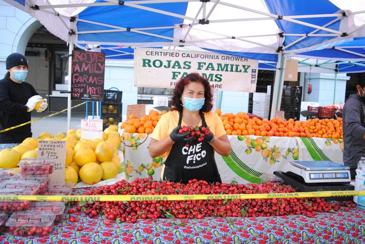 Farmers and shoppers alike are asked to wear masks at the Ferry Plaza Farmers Market in San Francisco.