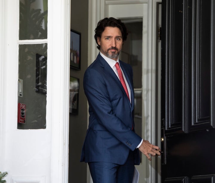 Prime Minister Justin Trudeau arrives for his daily news conference on the COVID-19 pandemic outside his residence at Rideau Cottage in Ottawa, on May 19, 2020. 