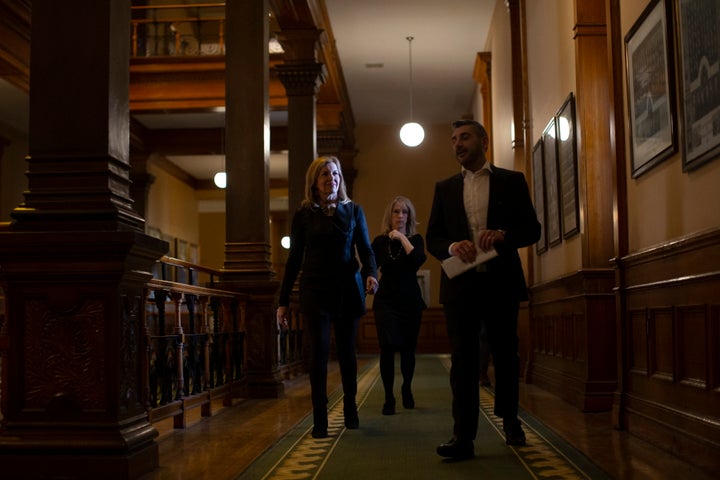 Ontario's Minister of Health Christine Elliott, left, walks with Ross Romano, Minister of Colleges and Universities and Merrilee Fullerton, Minister of Long Term Care, at Queen's Park in Toronto on April 18, 2020.