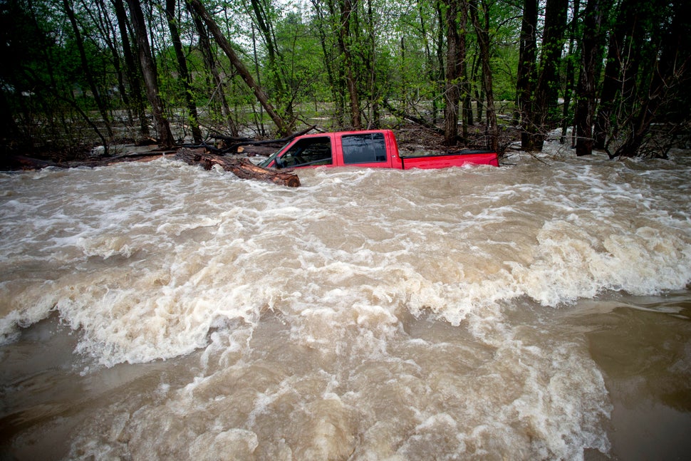 Tittabawassee Fire and Rescue rescued the driver from this red pickup truck on Tuesday in Saginaw County, Mich. The truck was