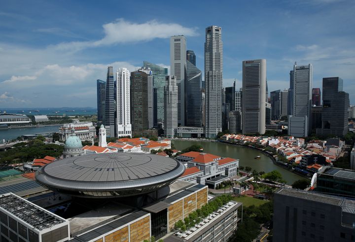 A view of the Supreme Court building in the backdrop of the skyline of Singapore's central business district.