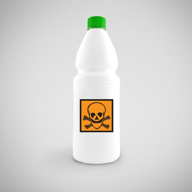 Bottle of chemical liquid with hazard symbol for toxic material