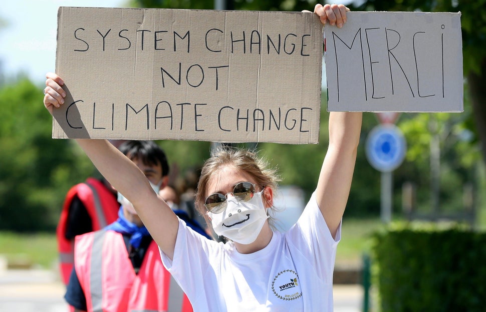 People stage a demonstration in front of Saint-Luc hospital to show solidarity with health members who are fighting against the coronavirus pandemic in Brussels, Belgium on May 20. Governments have an opportunity to put the climate at the heart of economic recovery.