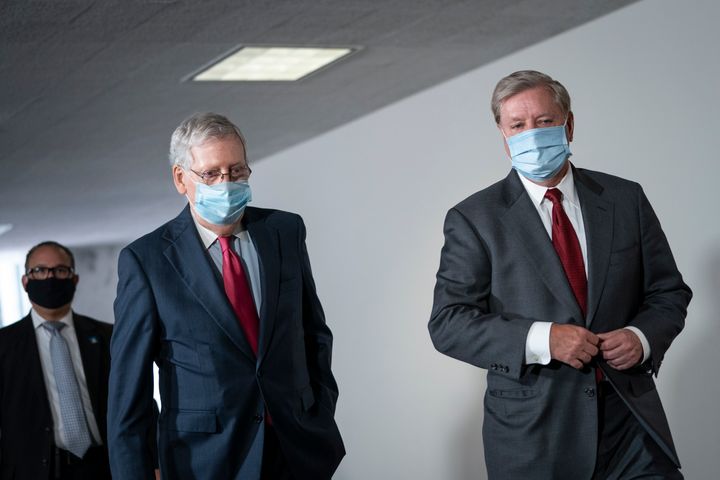 Senate Majority Leader Mitch McConnell (R-Ky.) and Sen. Lindsey Graham (R-S.C.) arrive for a meeting with GOP senators on Capitol Hill, May 19, 2020. 