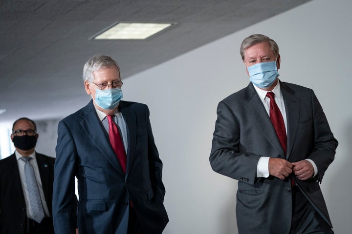 Senate Majority Leader Mitch McConnell (R-Ky.) and Sen. Lindsey Graham (R-S.C.) arrive for a meeting with GOP senators on Capitol Hill, May 19, 2020.