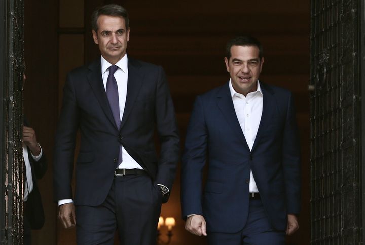 Outgoing Prime Minister Alexis Tsipras (R) exits the Prime Minister's office at Maximos mansion after handing over to the newly appointed Kyriakos Mitsotakis in Athens on July 8; 2019 (Photo by Panayotis Tzamaros/NurPhoto via Getty Images)