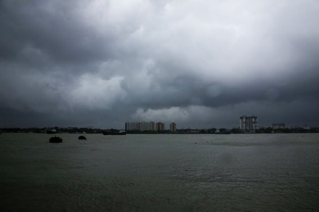 Rain clouds hover over the Hooghly River in Kolkata, India, Wednesday, May 20,