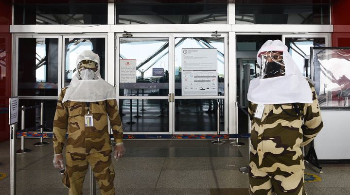 CISF personnel seen wearing protective headgear at Terminal 3 of IGI Airport on May 10, 2020 in New Delhi