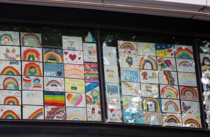 Drawings in support of the NHS in the windows of a college opposite St Thomas' Hospital in London as the UK continues in lockdown to help curb the spread of the coronavirus.