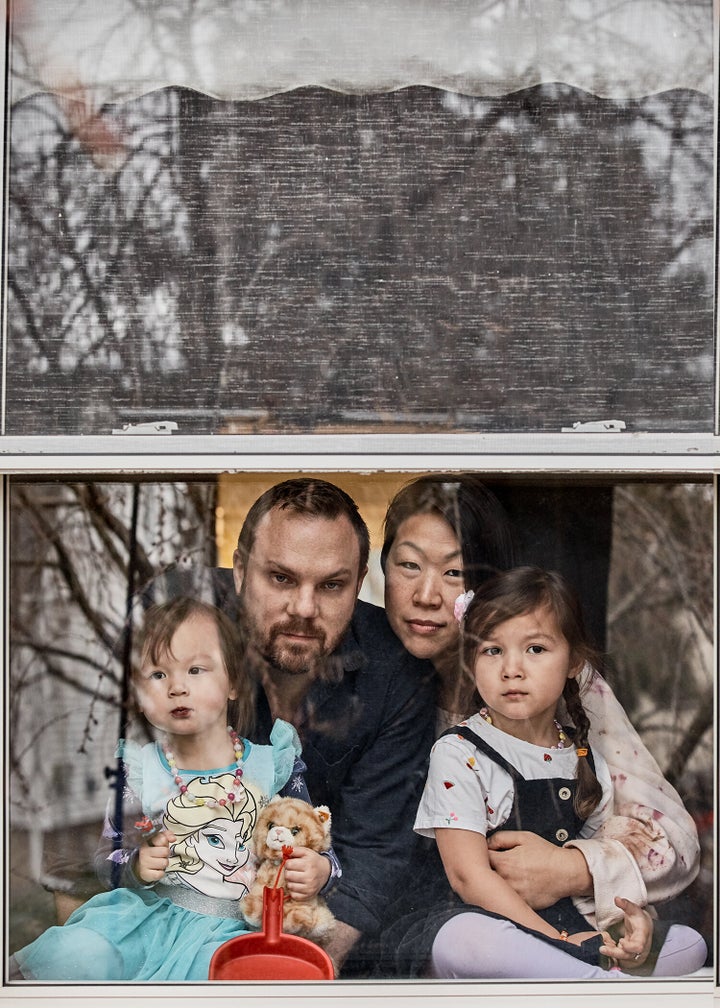 Michael Oliverio (left) and Barbara Kwon with their two daughters, ages 4 and 2.