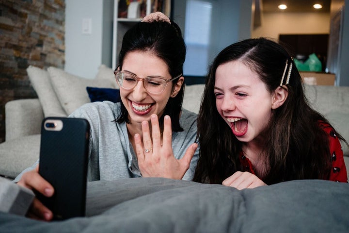 "Because we couldn't go to our families in person and tell them the good news, we decided to FaceTime everyone from our living room. This shot happened when Molly's aunt completely freaked out in excitement."