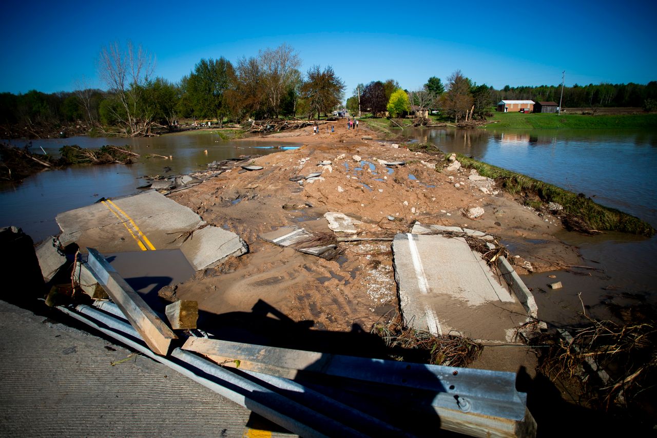 Ruins of the Curtis Road Bridge lie asunder as waters continue to roil on May 20, 2020, in Edenville Township north of Midland. After two days of heavy rain, the Edenville Dam failed and floodwaters rushed south, ravaging the landscape in its path. 