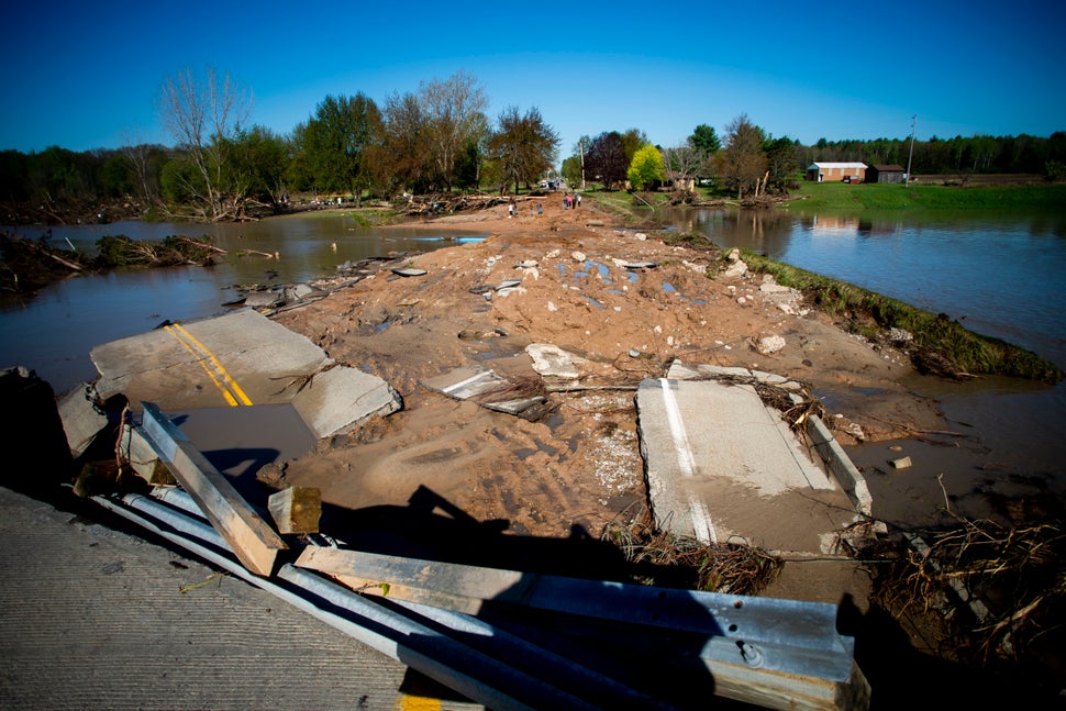 Ruins of the Curtis Road Bridge lie asunder as waters continue to roil on May 20, 2020, in Edenville Township north of Midlan