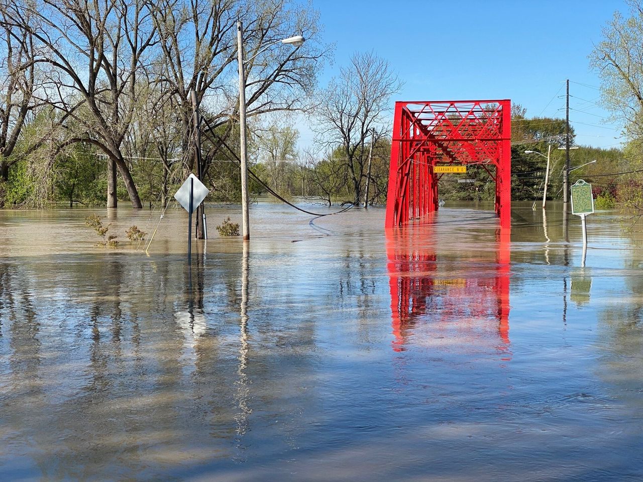 Floodwaters overwhelm a bridge two blocks from the home of Armin Mersmann, a Midland-based artist.