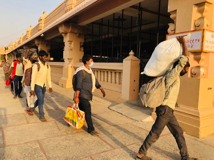 Migrant workers arriving at a temporary shelter at the Chhatarpur temple in New Delhi. 