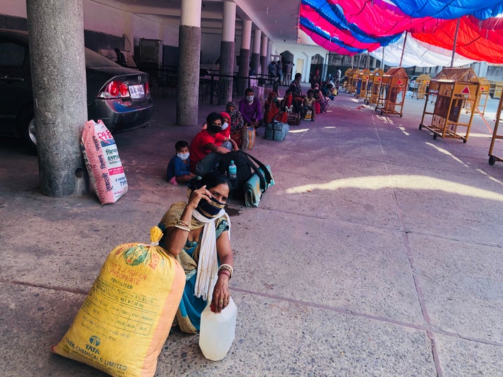 Migrant workers waiting in line for medical screening in Chhatarpur, New Delhi.