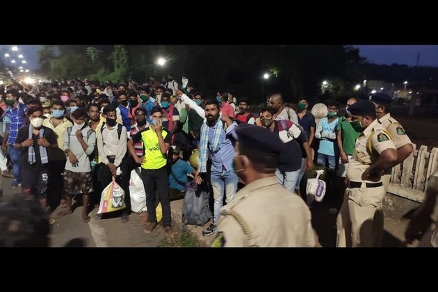 Migrant workers from Madhya Pradesh outside a government shelter in South