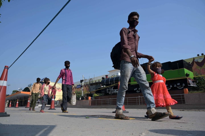 Prayagraj: Migrant workers stranded in Gujrat arrived from a special train during a government-imposed nationwide lockdown as a preventive measure against the COVID-19 coronavirus, in Prayagraj on May 6, 2020.