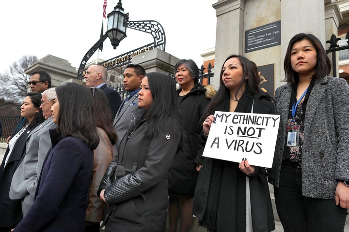 Members of the Asian American Commission, on the steps of the Massachusetts State House in Boston, condemn racism towards their community on March 12, 2020.