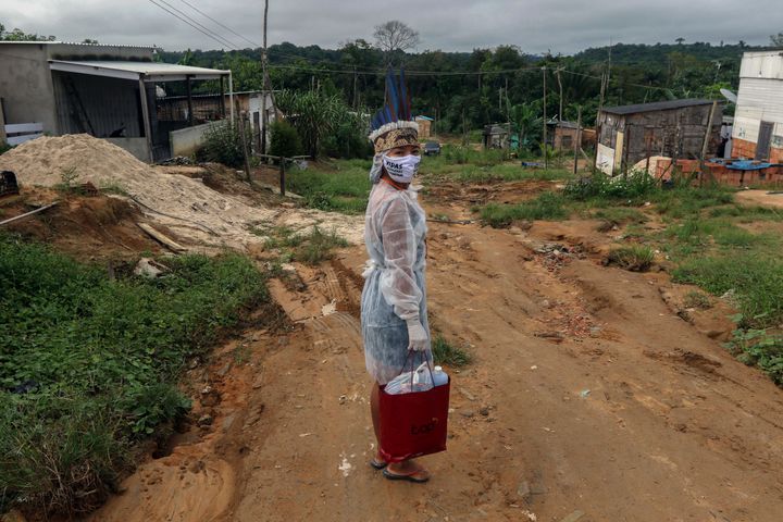 Witoto Indigenous nursing assistant Vanda Ortega, 32, on a round of health care visits in the Parque das Tribos, an Indigenous community in the suburbs of Manaus, Brazil, on May 3.