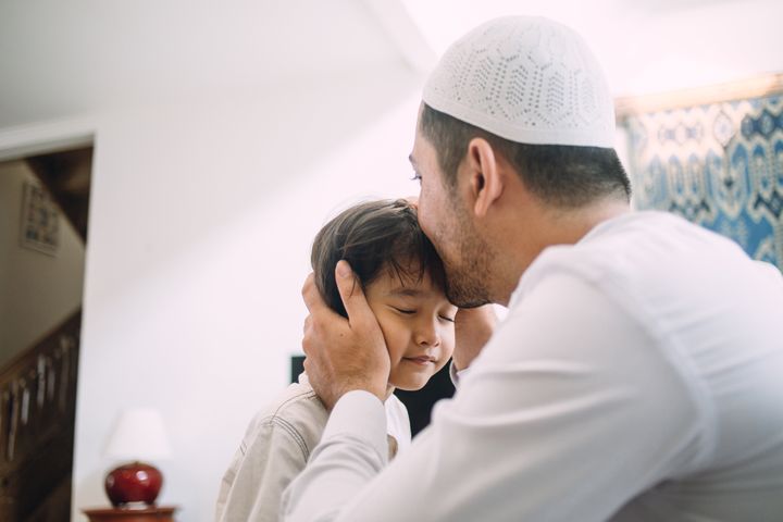 Family celebrating Eid al-Fitr and asking for forgiveness