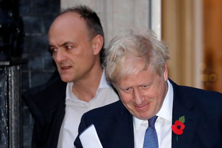 Britain's Prime Minister Boris Johnson, right, and advisor Dominic Cummings, left. Cummings is accused of flouting coronaviru
