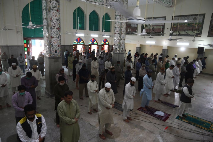 Muslim devotees offer Friday prayers at a mosque during the Islamic holy month of Ramadan in Lahore on May 8.