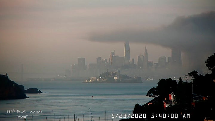 This photo provided by National Weather Service San Francisco Bay Area, smoky conditions linger after a fire broke out before dawn on San Francisco's Fisherman's Wharf and destroyed a warehouse, Saturday, May 23, 2020 in San Francisco.