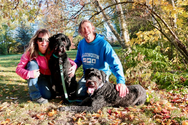 Steve Lanys-Morris, seen in this undated photo, with his wife and their service dogs, says there’s a higher cost of living associated with disability.