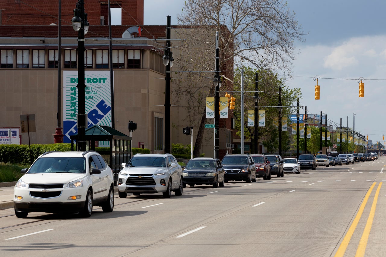 Cars line Woodward Avenue with a police escort as they head toward Campus Martius Park all the way from the Muslim Center Masjid during the Woodward Eid Cruise on Sunday, May 24, in Detroit. Eid al-Fitr marks the end of the holy month of Ramadan.